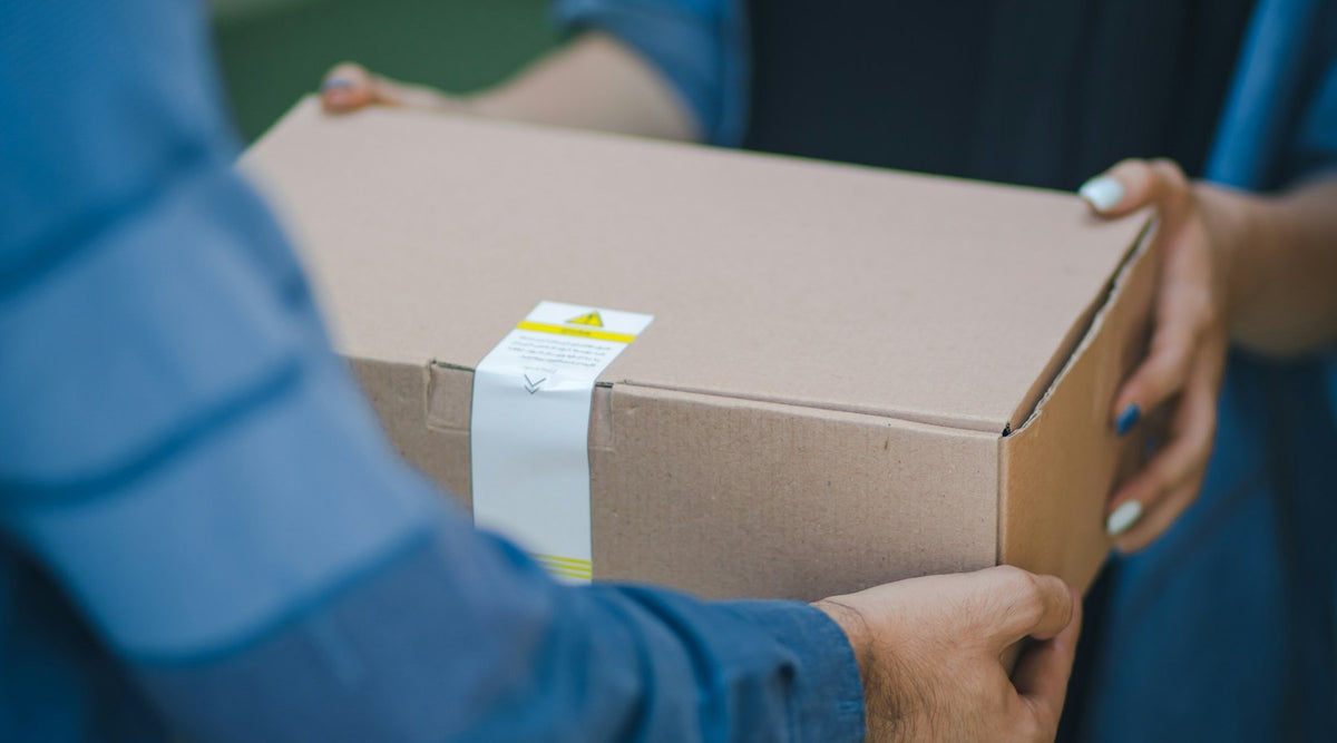 A parcel being handed over on delivery
