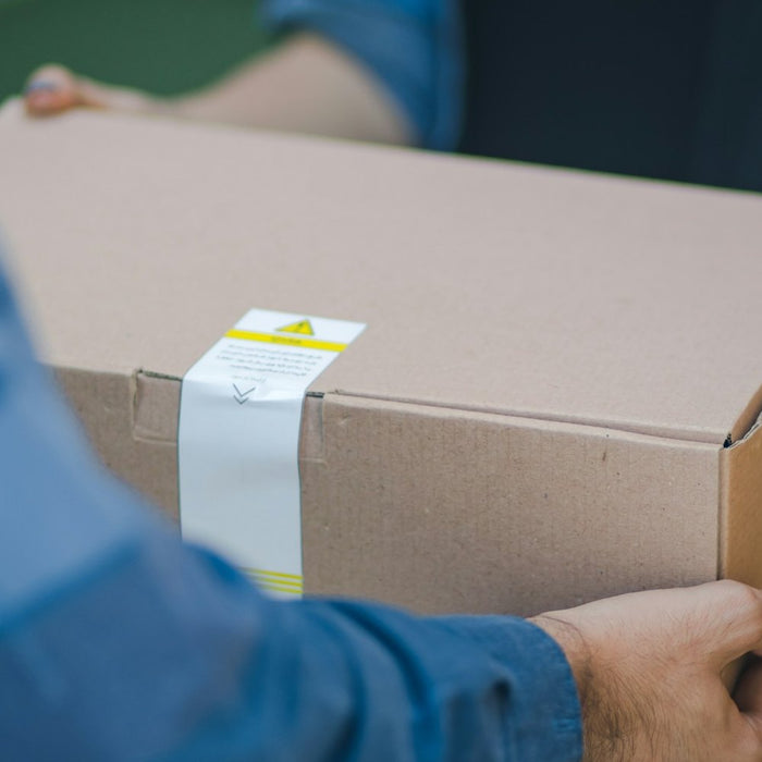 A parcel being handed over on delivery
